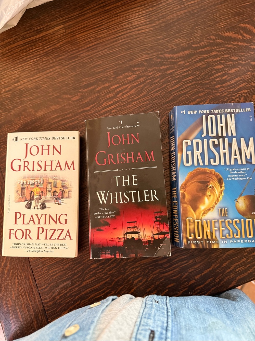 Three John Grisham Paperback Books